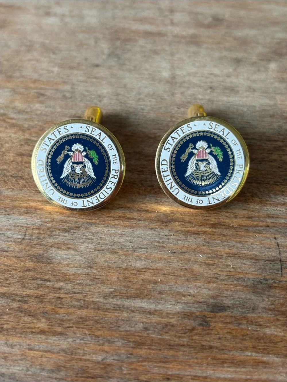 Gold-toned cufflinks feature a full-color enamel Presidential Seal.